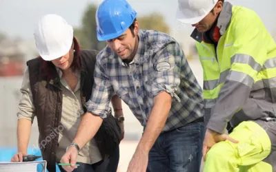 construction workers looking at blueprints